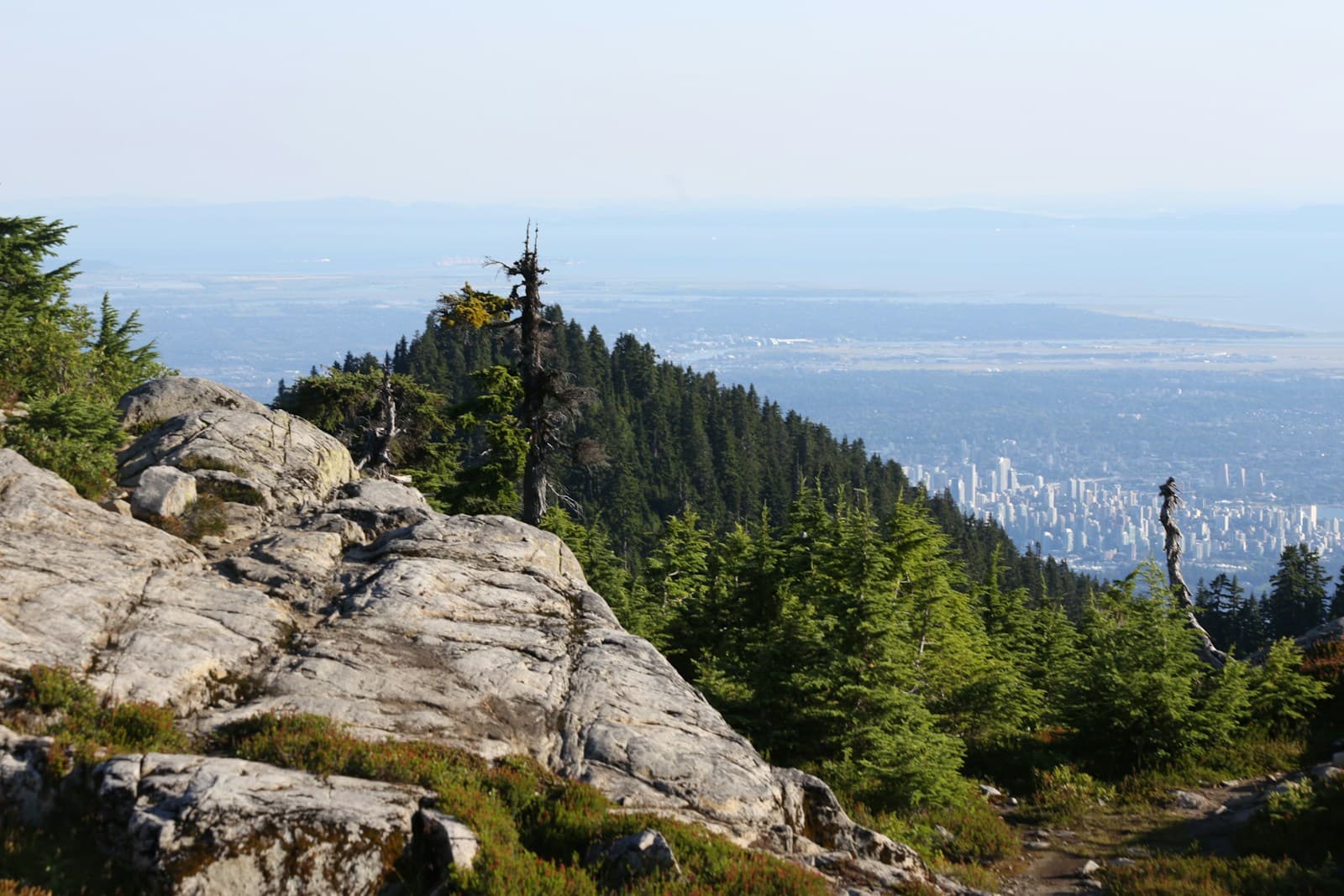 Hikers moving along a mountain ridge trail